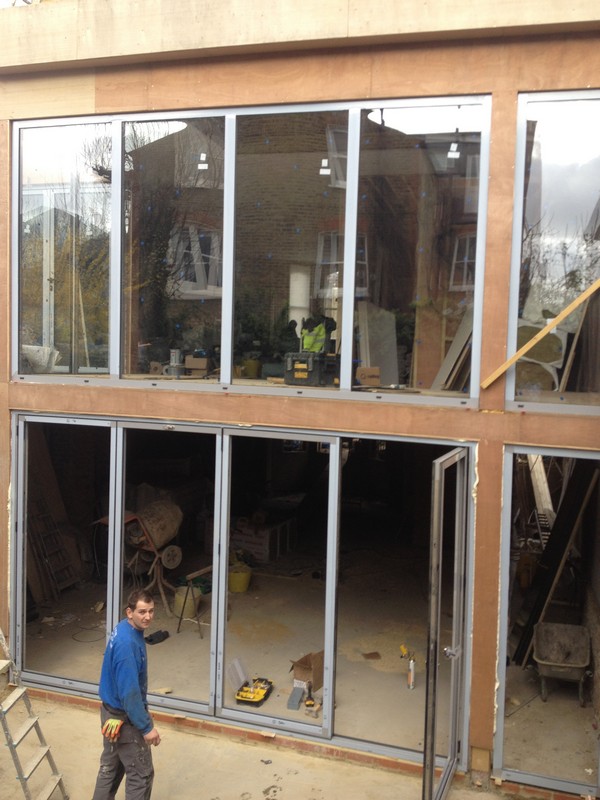 Aluminium bi-fold doors with two-storey glazing in South Kensington