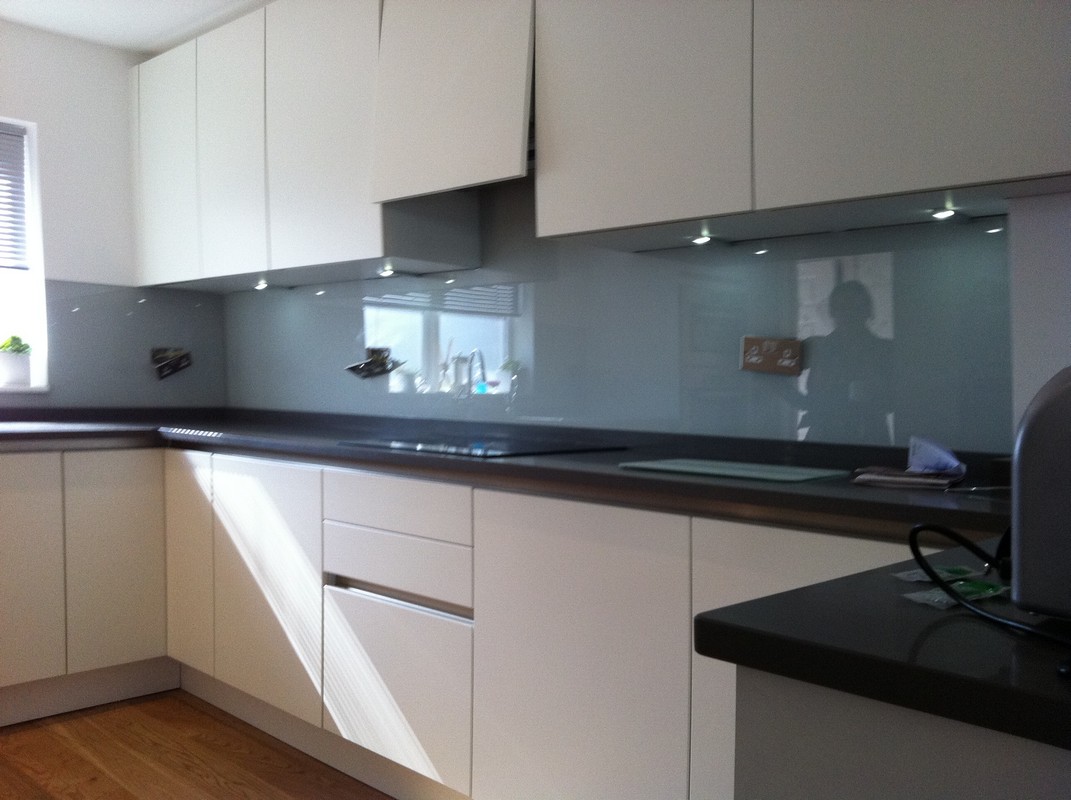 Grey glass kitchen splashback with LED lighting in South Kensington